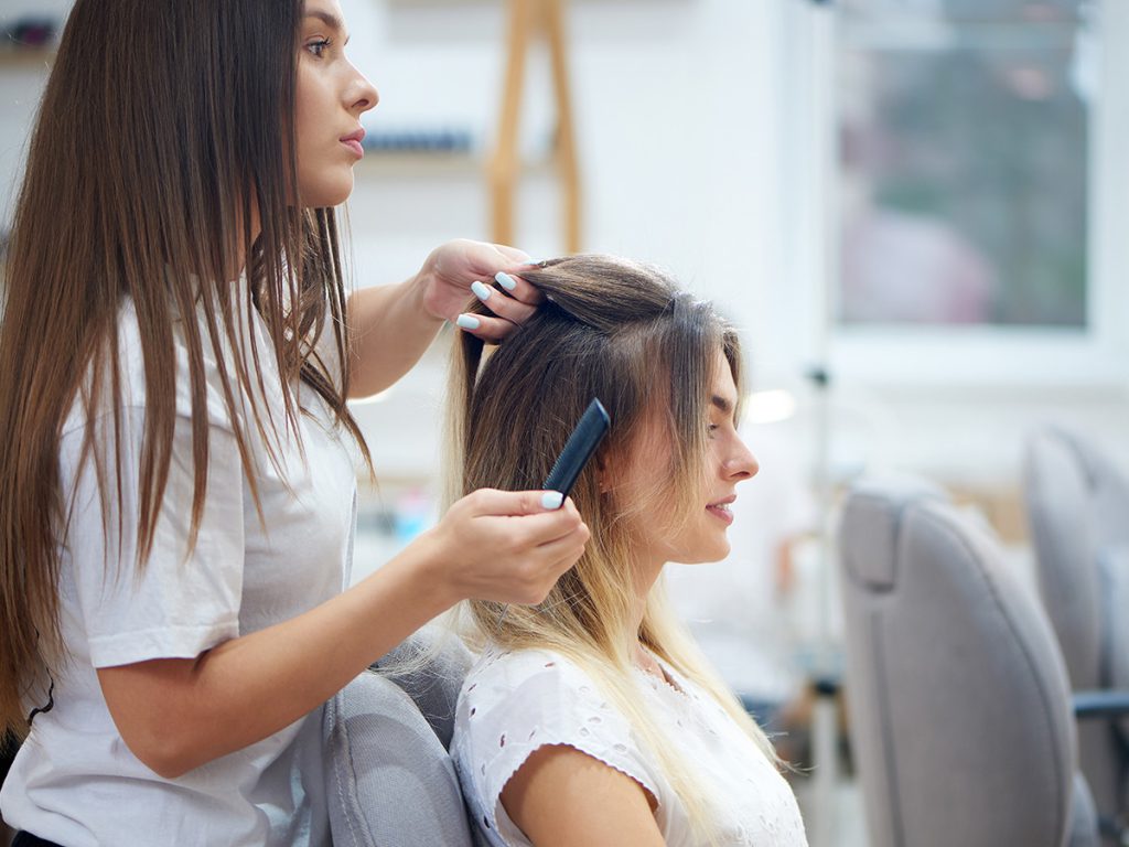 Image of woman in a salon styling her hair